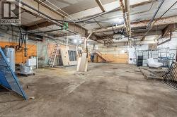 Basement featuring water heater -