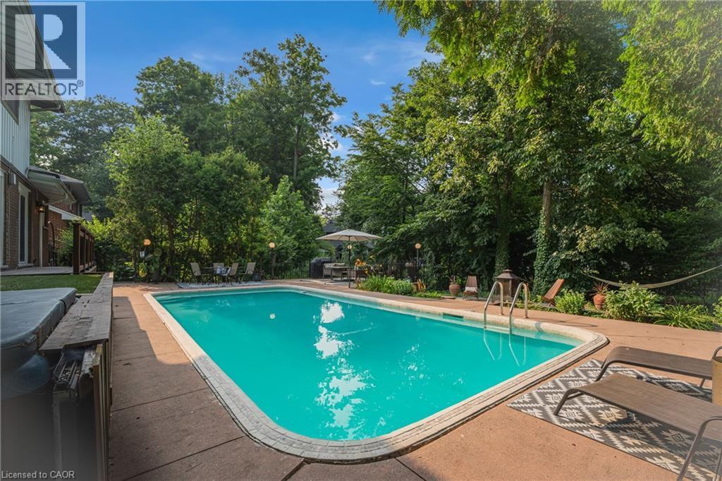 316 Fennell Avenue W, Hamilton, ON - Outdoor With In Ground Pool With Deck Patio Veranda With Backyard