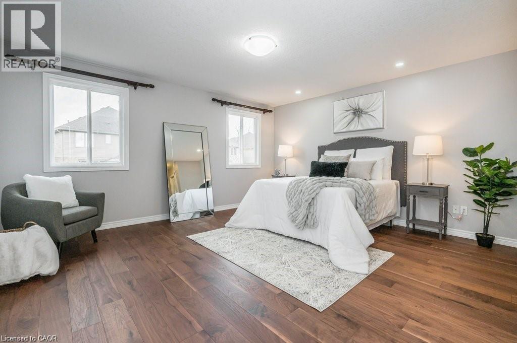 Bedroom with dark wood-type flooring - 609 Woolgrass Avenue, Waterloo, ON - Indoor Photo Showing Bedroom