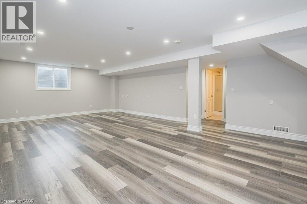 Basement featuring light wood-style floors and recessed lighting - 609 Woolgrass Avenue, Waterloo, ON - Indoor