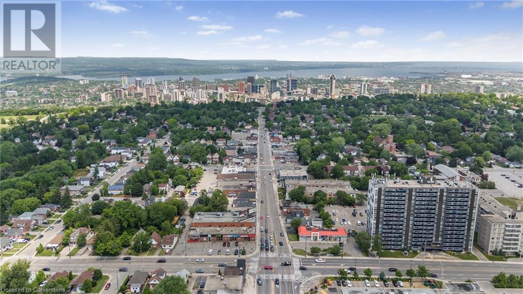 Aerial view of property and surrounding area featuring nearby urban area and a highway - 622 Upper James Street, Hamilton, ON