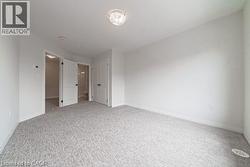 Unfurnished bedroom featuring carpet floors and a closet -