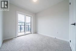 Unfurnished room featuring carpet flooring and baseboards -