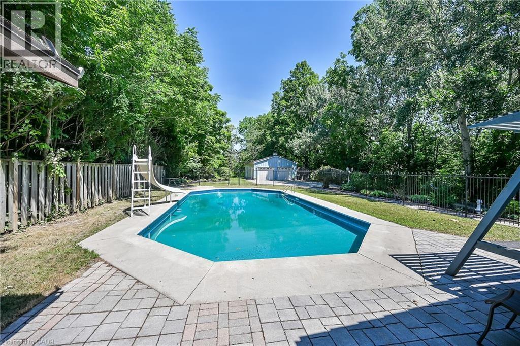 94 Sutherland Street W, Caledonia, ON - Outdoor With In Ground Pool With Backyard