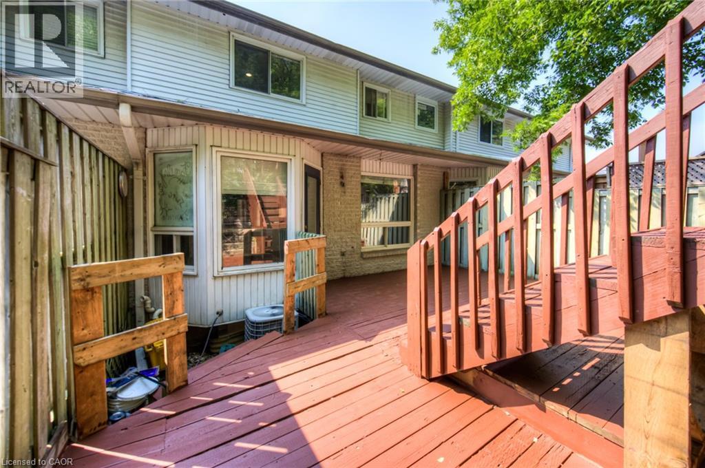 View of wooden terrace - 20 Bankside Drive, Kitchener, ON - Outdoor With Exterior