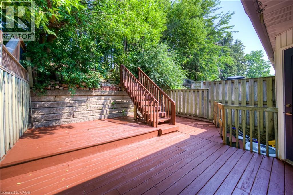 Wooden terrace featuring a fenced backyard and stairway - 20 Bankside Drive, Kitchener, ON - Outdoor With Exterior