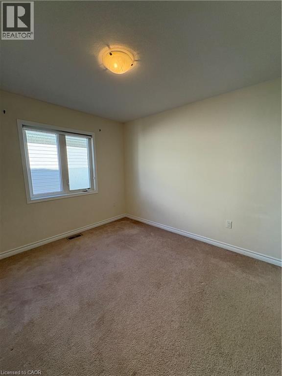 Empty room featuring baseboards and carpet - 50 Shoreacres Drive, Kitchener, ON - Indoor Photo Showing Other Room