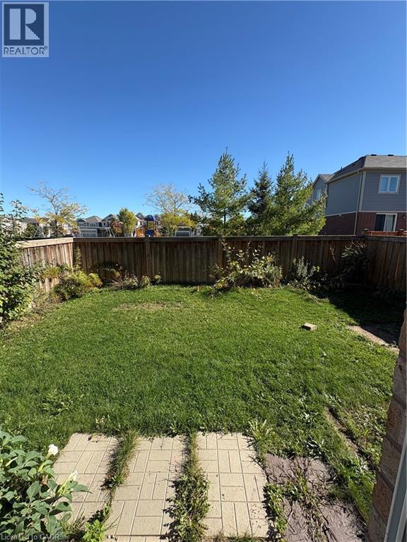 View of fenced backyard - 50 Shoreacres Drive, Kitchener, ON - Outdoor With Backyard