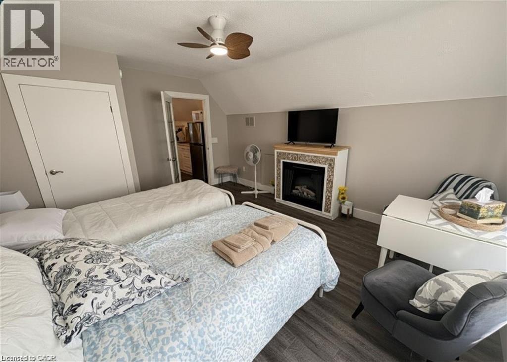 691 Wilson Street, Hamilton, ON - Indoor Photo Showing Bedroom With Fireplace