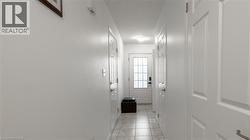 Doorway to outside featuring a textured ceiling -