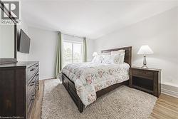 Primary bedroom with walk-out to balcony -