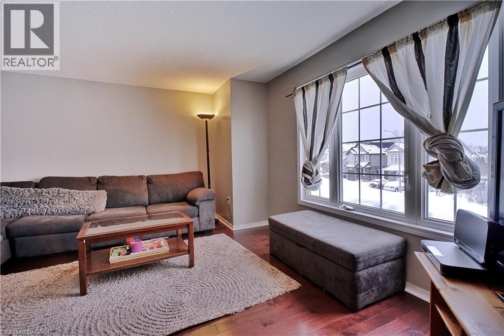 Living area with hardwood / wood-style flooring and baseboards - 206 Westmeadow Drive, Kitchener, ON - Indoor Photo Showing Living Room
