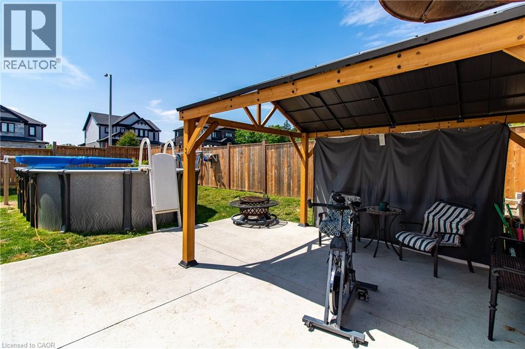 39 Basswood Road, Simcoe, ON - Outdoor With Above Ground Pool