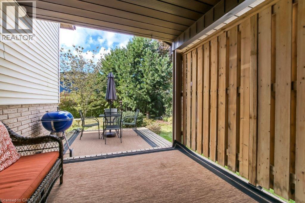 View of patio / terrace featuring a grill and outdoor dining area - 2 Falls Crescent, Simcoe, ON - Outdoor With Exterior