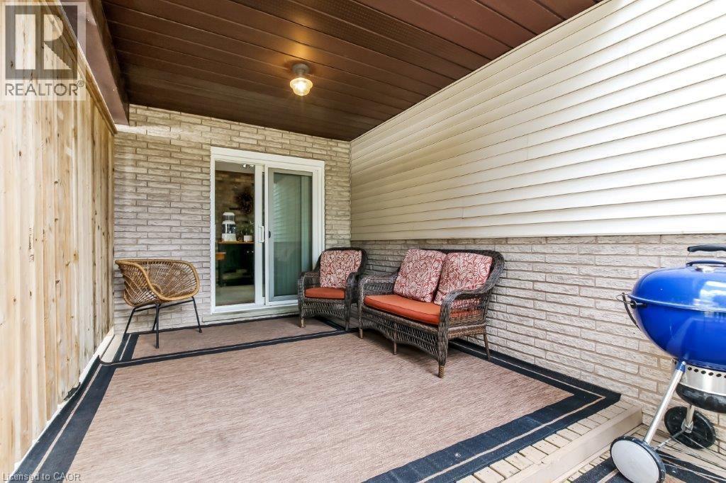 Wooden deck featuring a grill and a patio area - 2 Falls Crescent, Simcoe, ON - Outdoor With Deck Patio Veranda With Exterior