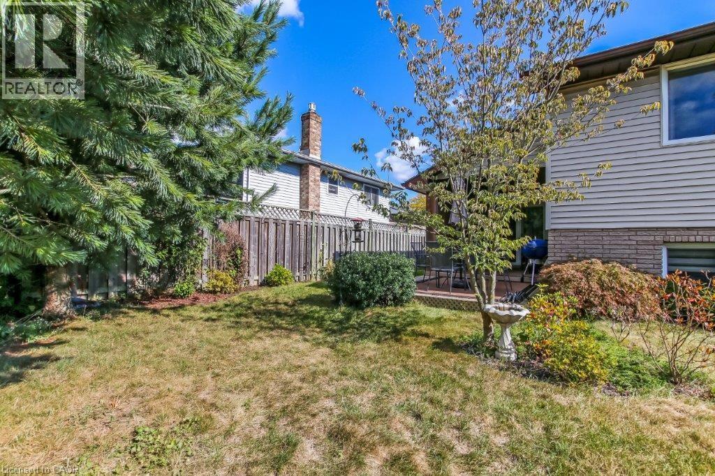 View of yard featuring a wooden deck - 2 Falls Crescent, Simcoe, ON - Outdoor