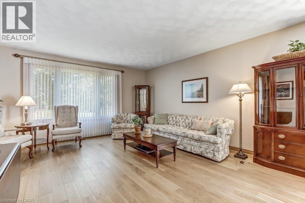 Living room with light wood-style floors - 2 Falls Crescent, Simcoe, ON - Indoor Photo Showing Living Room