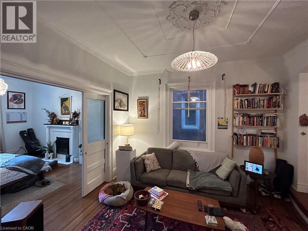 207 Charlton Avenue W Unit# Main, Hamilton, ON - Indoor Photo Showing Living Room With Fireplace