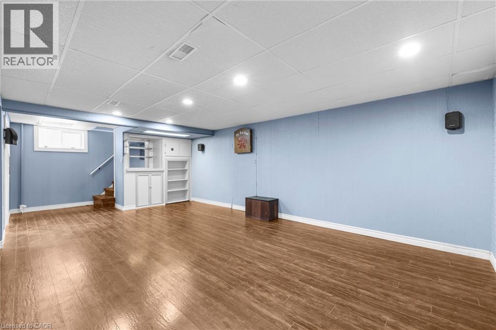 Basement with stairway, dark wood-style flooring, a drop ceiling, and recessed lighting - 368 Upper Kenilworth Avenue, Hamilton, ON - Indoor Photo Showing Basement