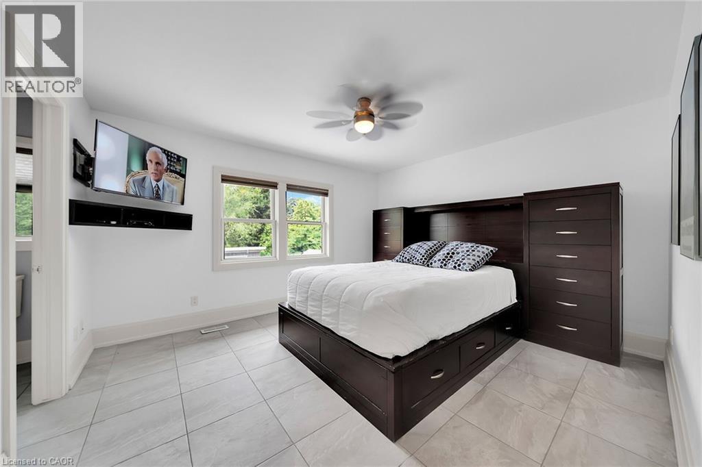 Bedroom with a ceiling fan and light tile patterned floors - 404 Mountain Brow Boulevard E, Hamilton, ON - Indoor Photo Showing Bedroom