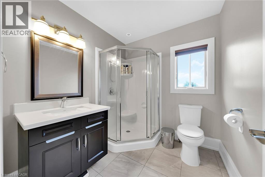 Full bathroom featuring vanity, a shower stall, and light tile patterned flooring - 404 Mountain Brow Boulevard E, Hamilton, ON - Indoor Photo Showing Bathroom