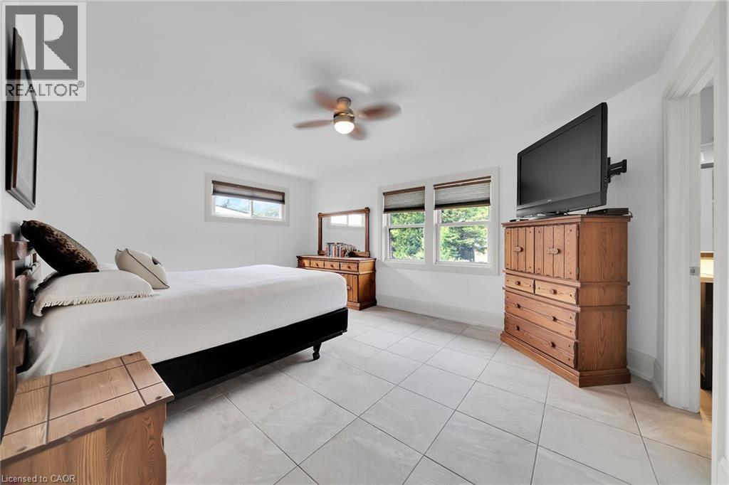 Bedroom featuring light tile patterned floors and ceiling fan - 404 Mountain Brow Boulevard E, Hamilton, ON - Indoor Photo Showing Bedroom