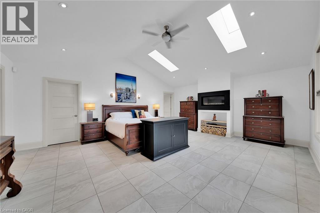 Bedroom featuring ceiling fan, vaulted ceiling, a skylight, light tile patterned flooring, and recessed lighting - 404 Mountain Brow Boulevard E, Hamilton, ON - Indoor Photo Showing Other Room