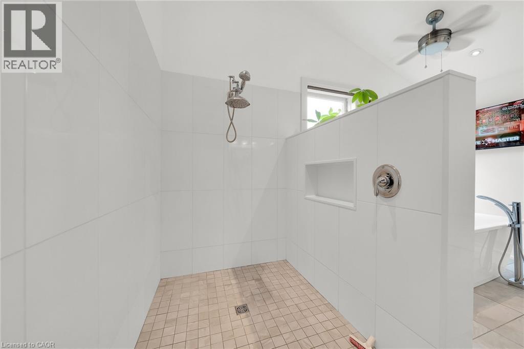 Bathroom with a tile shower, ceiling fan, light tile patterned floors, and a freestanding tub - 404 Mountain Brow Boulevard E, Hamilton, ON - Indoor