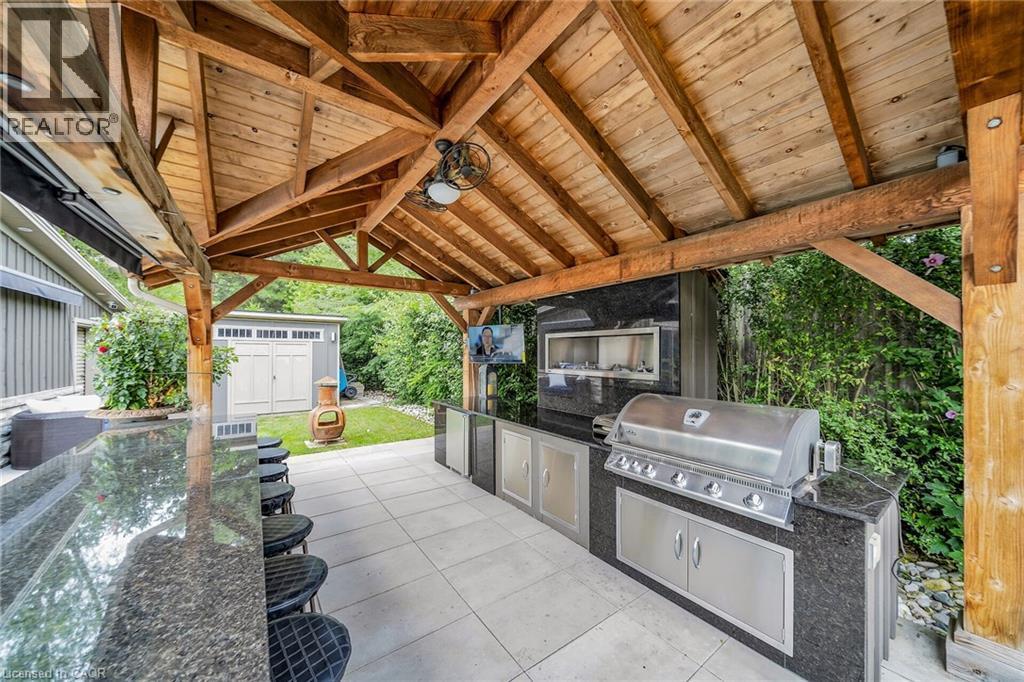 View of patio featuring a storage shed and exterior kitchen - 404 Mountain Brow Boulevard E, Hamilton, ON - Outdoor With Exterior