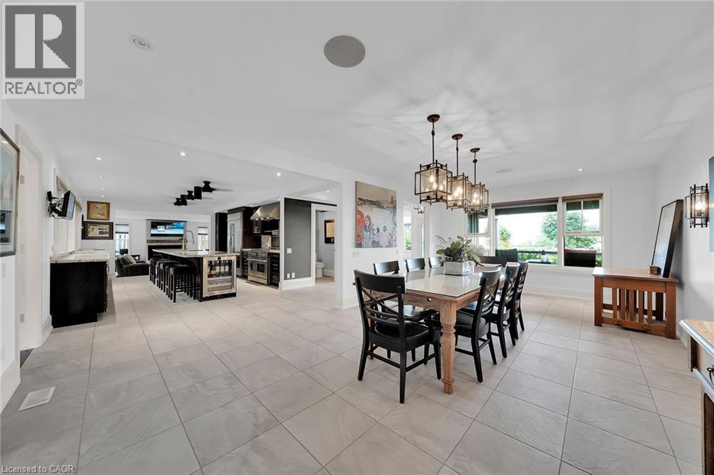 Dining area featuring light tile patterned flooring, recessed lighting, and wine cooler - 404 Mountain Brow Boulevard E, Hamilton, ON - Indoor Photo Showing Dining Room