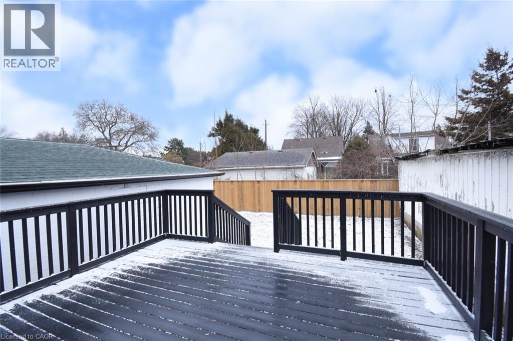 Wooden deck with a fenced backyard - 215 Walter Avenue S, Hamilton, ON - Outdoor With Deck Patio Veranda