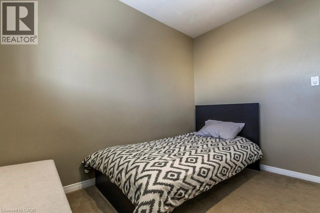 Carpeted bedroom with baseboards - 22 Redwing Road, Hamilton, ON - Indoor Photo Showing Bedroom