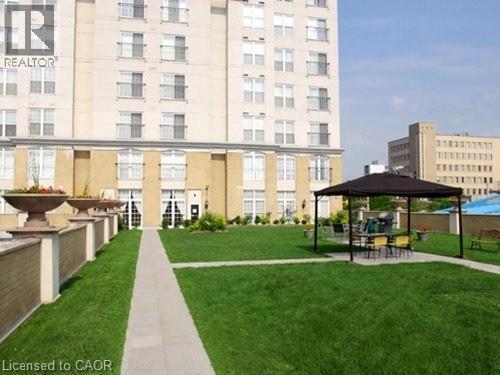 View of home's community featuring a lawn - 135 James Street Unit# 608, Hamilton, ON -