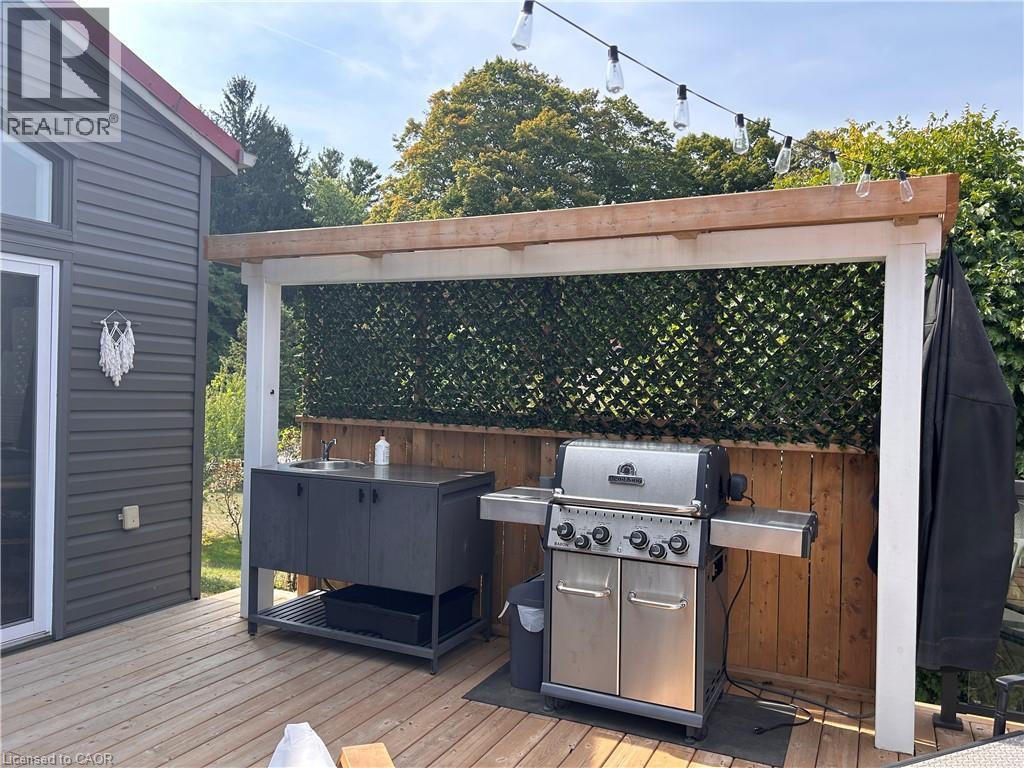 wet bar and gas BBQ - 657 Windham Road 14, Simcoe, ON - Outdoor With Deck Patio Veranda