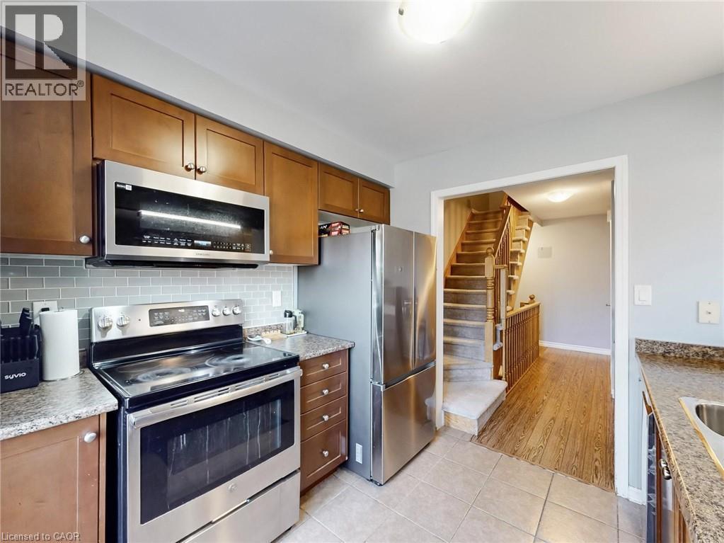 597 Speyer Circle, Milton, ON - Indoor Photo Showing Kitchen With Double Sink