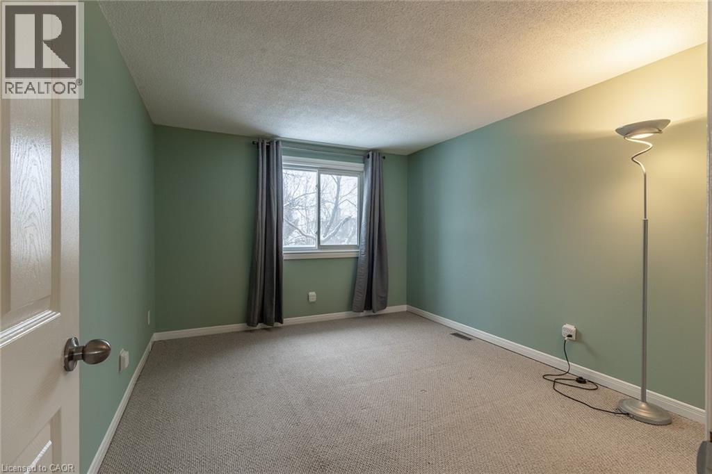 Unfurnished room with carpet flooring and a textured ceiling - 58 Romy Crescent, Thorold, ON - Indoor Photo Showing Other Room