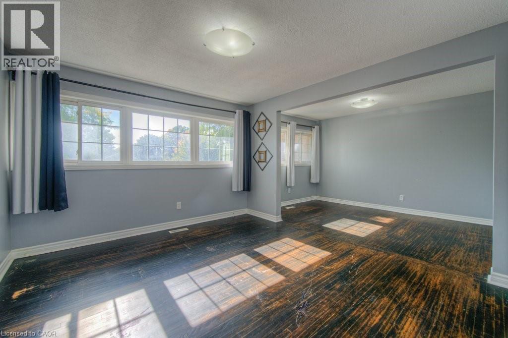Spare room featuring baseboards and a textured ceiling - 46 Guerin Avenue, Kitchener, ON - Indoor Photo Showing Other Room