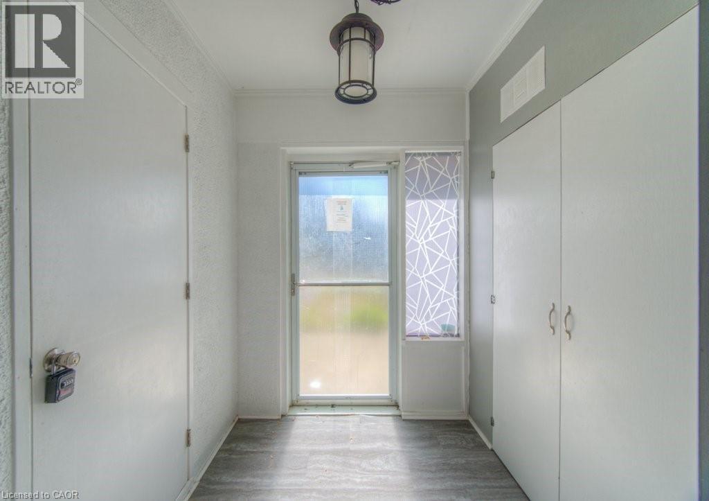 Entryway with wood finished floors and ornamental molding - 46 Guerin Avenue, Kitchener, ON - Indoor Photo Showing Other Room