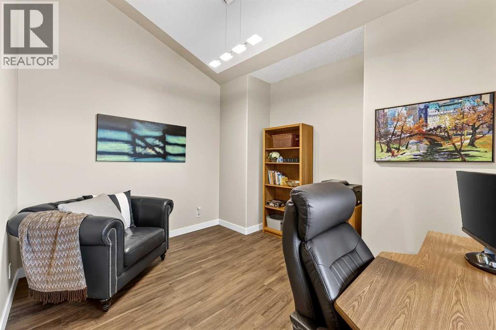 large flex room with cantilever is formal dining room, or why not indulge in a true home office? - 509 Riverview Place Se, Calgary, AB - Indoor Photo Showing Office