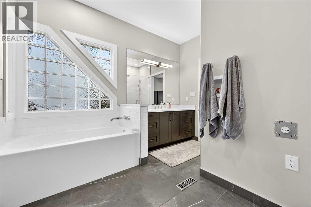 Glass block window for added privacy - 509 Riverview Place Se, Calgary, AB - Indoor Photo Showing Bathroom