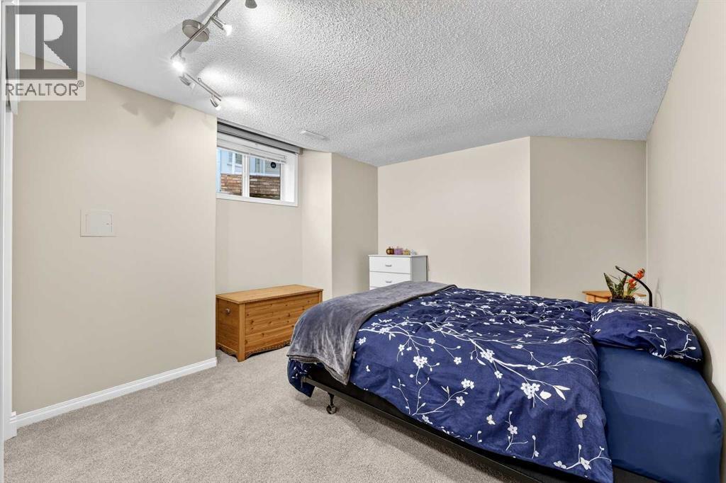 Bedroom four (one of tw in the basement) - 509 Riverview Place Se, Calgary, AB - Indoor Photo Showing Bedroom