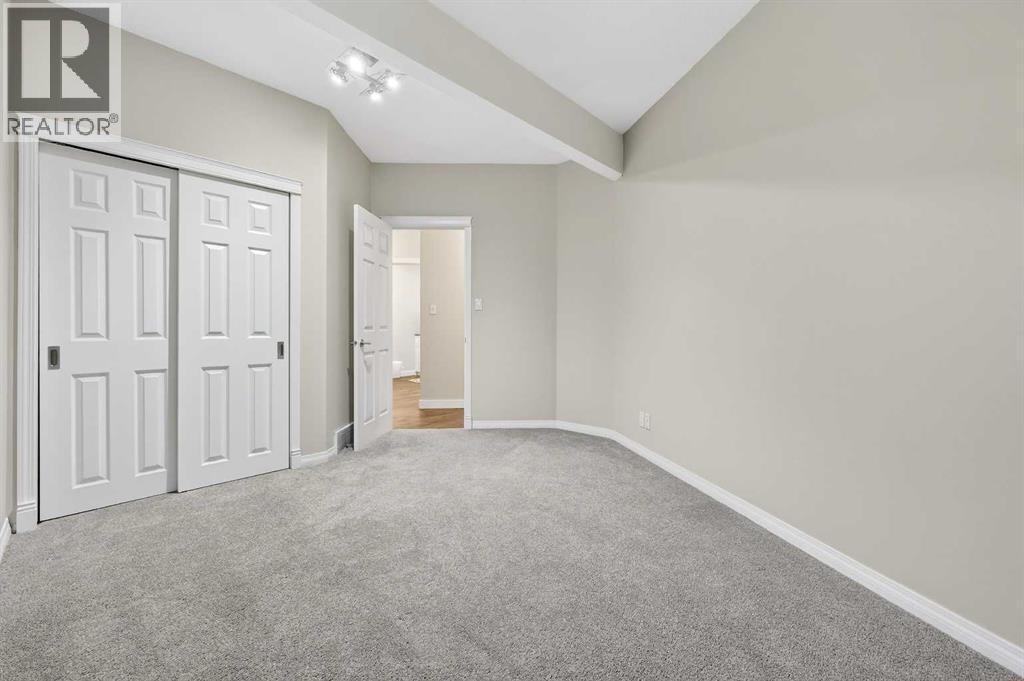 Bedroom FIVE (second one in the basement) is a great guest room - 509 Riverview Place Se, Calgary, AB - Indoor Photo Showing Other Room