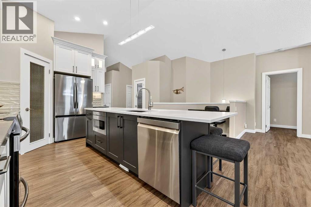 Room for stools at the island - 509 Riverview Place Se, Calgary, AB - Indoor Photo Showing Kitchen With Upgraded Kitchen