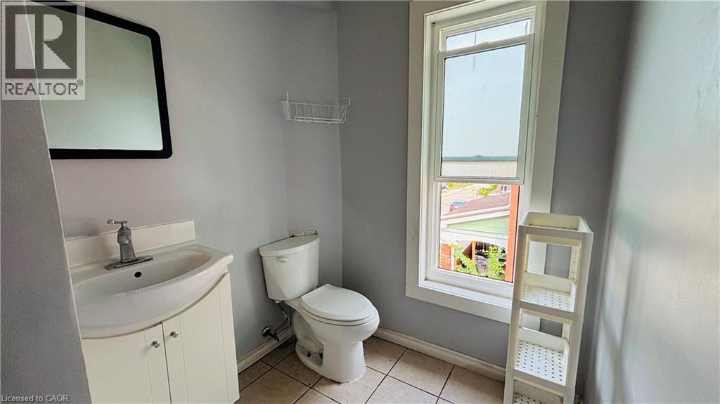 Bathroom with light tile patterned flooring, vanity, and a water view - 30 Regina Street N, Waterloo, ON - Indoor Photo Showing Bathroom