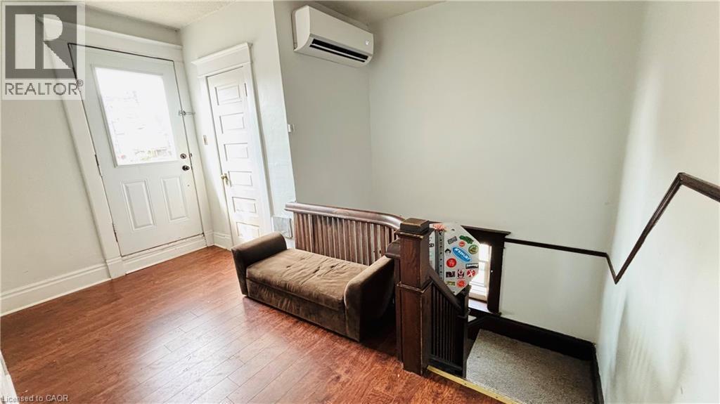 Entryway with wood finished floors and a wall unit AC - 30 Regina Street N, Waterloo, ON - Indoor