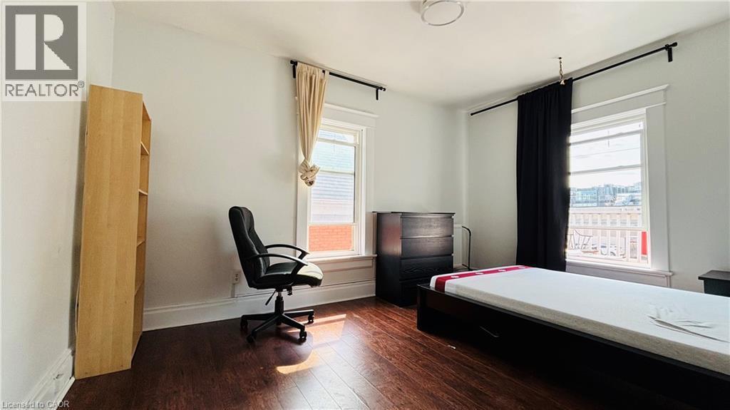 Bedroom featuring dark wood finished floors and a desk - 30 Regina Street N, Waterloo, ON - Indoor