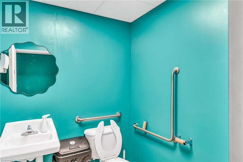 Half bath with a drop ceiling and toilet - 612 King Street E, Kitchener, ON