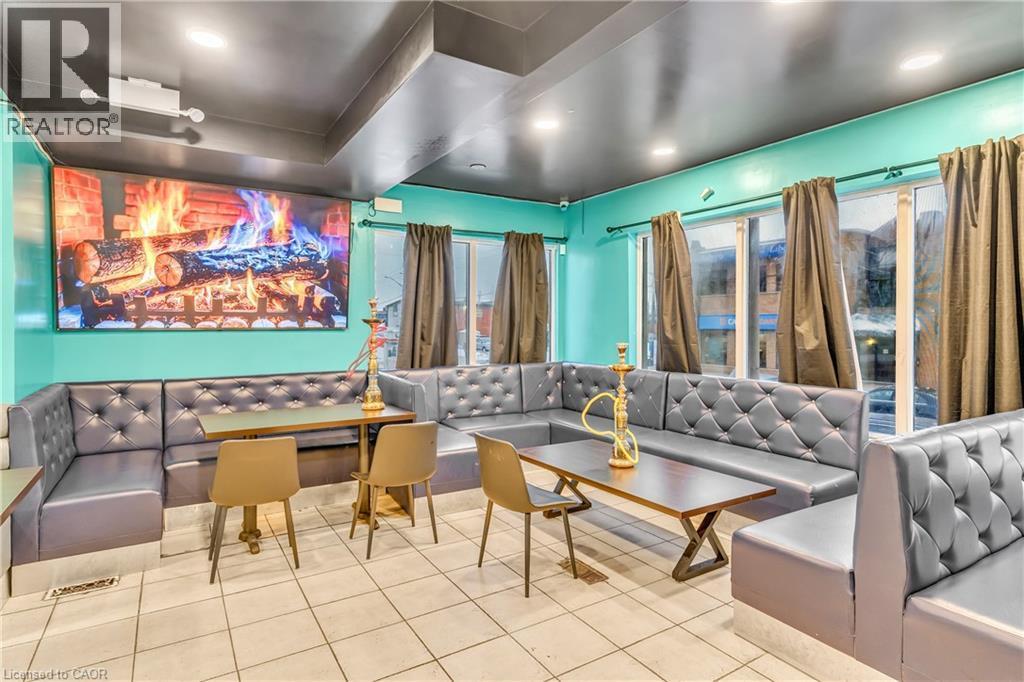 Home theater room featuring tile patterned flooring and recessed lighting - 612 King Street E, Kitchener, ON