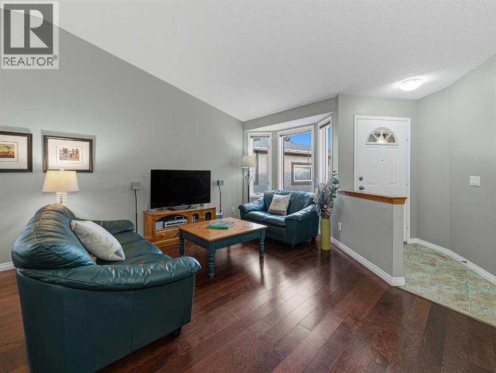 301 Arbour Cliff Close Nw, Calgary, AB - Indoor Photo Showing Living Room