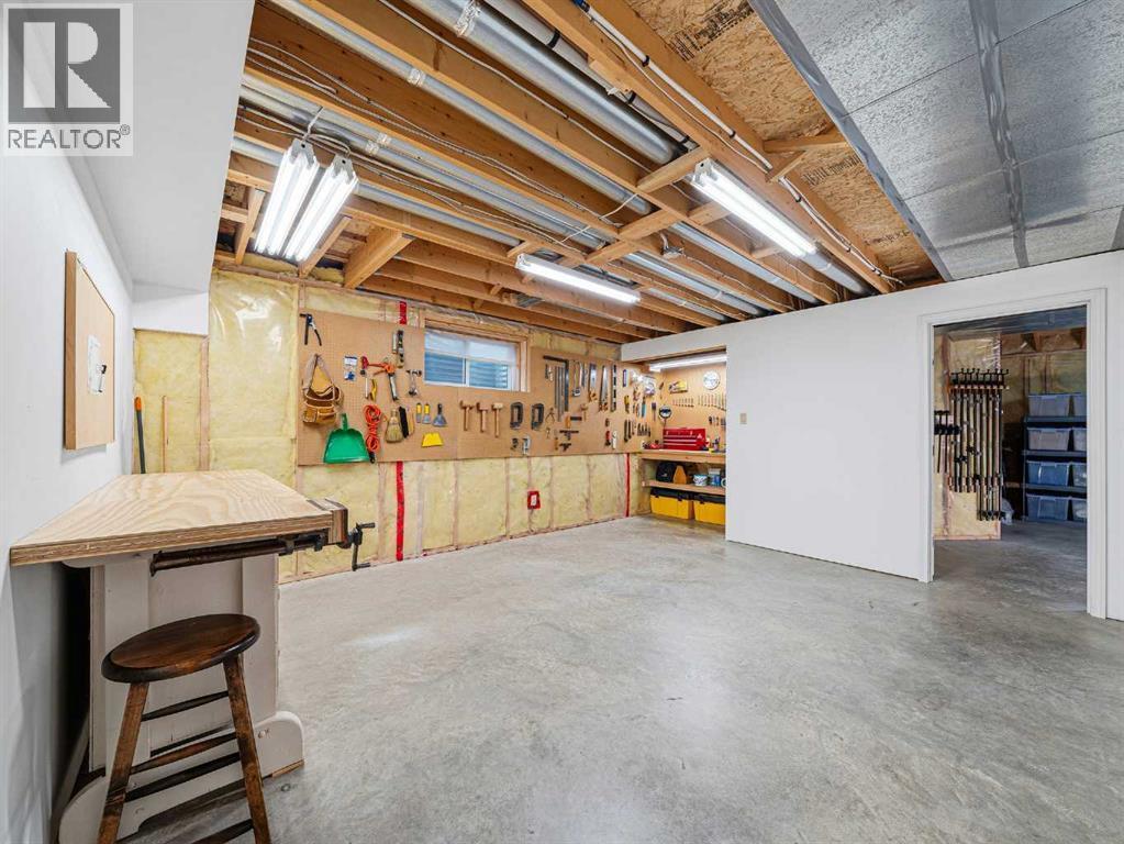 Basement Workshop. Easily Converted to 3rd Bedroom - 301 Arbour Cliff Close Nw, Calgary, AB - Indoor Photo Showing Basement